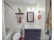 Modern bathroom with a black vanity, white walls, tiled floors and stylish decorative touches at 615 Ridgeway Dr, Belmont, NC 28012
