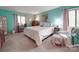 Cozy bedroom with queen bed, white chair, and pastel walls creating a relaxing atmosphere at 615 Ridgeway Dr, Belmont, NC 28012