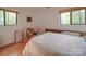 Bedroom with two windows, parquet floors, and some items that could be organized at 615 Ridgeway Dr, Belmont, NC 28012