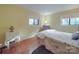 Bright bedroom with two windows and parquet floors, providing a comfortable space at 615 Ridgeway Dr, Belmont, NC 28012
