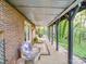 A covered outdoor patio with brick columns offering an inviting space for relaxation at 615 Ridgeway Dr, Belmont, NC 28012