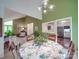 Open dining room with green walls offering views into the living room and kitchen at 615 Ridgeway Dr, Belmont, NC 28012