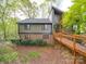 Charming home with a modern design featuring a wooden walkway and brick accents on the lower level at 615 Ridgeway Dr, Belmont, NC 28012
