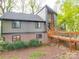 Unique home with wooden walkway leading to the front door and a combination brick and paneled facade at 615 Ridgeway Dr, Belmont, NC 28012
