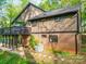Exterior view of the home with a second story deck and a combination of siding and brick at 615 Ridgeway Dr, Belmont, NC 28012