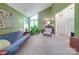 Bright living room features high ceilings, large windows, and neutral carpeting at 615 Ridgeway Dr, Belmont, NC 28012
