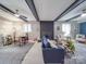 Open concept living room with exposed ceiling beams, fireplace, and stylish decor at 615 Ridgeway Dr, Belmont, NC 28012