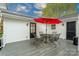 Outdoor deck featuring patio furniture, a red umbrella, and backyard views at 6307 Roanoke Dr # 17, Kannapolis, NC 28081