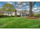Spacious backyard featuring a screened porch, patio, and lush lawn perfect for outdoor enjoyment at 6307 Roanoke Dr # 17, Kannapolis, NC 28081