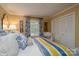 Charming bedroom features white shuttered window, plush pillows, and a wardrobe at 6307 Roanoke Dr # 17, Kannapolis, NC 28081