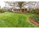 Expansive green lawn and manicured landscaping frame this brick home's exterior at 6307 Roanoke Dr # 17, Kannapolis, NC 28081