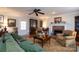 Relaxing living room featuring hardwood floors and a brick fireplace at 6307 Roanoke Dr # 17, Kannapolis, NC 28081