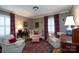 Cozy living room offers comfortable seating, wood floors, and natural light at 6307 Roanoke Dr # 17, Kannapolis, NC 28081