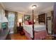 Comfortable primary bedroom featuring a four-poster bed and bedside tables at 6307 Roanoke Dr # 17, Kannapolis, NC 28081