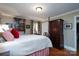 Spacious bedroom with a four-poster bed and wooden furniture at 6307 Roanoke Dr # 17, Kannapolis, NC 28081