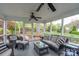 Inviting screened porch with wicker furniture and views of the landscaped backyard at 6307 Roanoke Dr # 17, Kannapolis, NC 28081