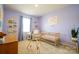 Charming Bedroom with a crib, soft blue walls, and playful decorations at 7036 Heron Rookery Way, Charlotte, NC 28214