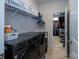 Well-equipped laundry room with modern washer/dryer and organized storage solutions at 7036 Heron Rookery Way, Charlotte, NC 28214