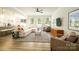 Spacious living room with plenty of natural light, open layout, and comfortable seating at 7036 Heron Rookery Way, Charlotte, NC 28214