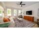 Bright living room with ample windows, stylish decor, and an inviting atmosphere at 7036 Heron Rookery Way, Charlotte, NC 28214