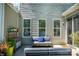 This patio features a lounge area with a couch and string lights overhead at 7036 Heron Rookery Way, Charlotte, NC 28214