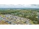 An aerial view featuring a quiet neighborhood surrounded by lush forestry at 7662 Tanglewood Way, Denver, NC 28037