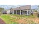 Spacious backyard featuring a well-maintained lawn and patio, perfect for outdoor gatherings at 7662 Tanglewood Way, Denver, NC 28037