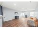Spacious living room with hardwood floors and plenty of natural light at 7662 Tanglewood Way, Denver, NC 28037