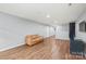 Open-concept living area featuring hardwood floors at 7662 Tanglewood Way, Denver, NC 28037