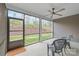 Enjoy the outdoors in this screened in patio with ceiling fan overlooking a landscaped yard at 7662 Tanglewood Way, Denver, NC 28037
