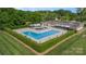 Bird's-eye view showcases the community pool, shaded seating areas, and manicured lawns, creating a resort-like feel at 8308 Knights Bridge Rd, Charlotte, NC 28210
