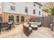 Backyard patio with dining table, seating area, and grill, perfect for outdoor gatherings and enjoying the outdoors at 8308 Knights Bridge Rd, Charlotte, NC 28210