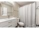 Cozy bathroom featuring a single sink, modern fixtures, and a shower at 8308 Knights Bridge Rd, Charlotte, NC 28210