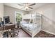 Bedroom with a bunk bed, computer desk, and hardwood floors at 8308 Knights Bridge Rd, Charlotte, NC 28210