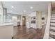 Bright, modern kitchen features stainless steel appliances, ample counter space, and dark hardwood floors at 8308 Knights Bridge Rd, Charlotte, NC 28210