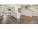 Open concept kitchen with a center island, stainless steel appliances, and seamless access to the living area at 8308 Knights Bridge Rd, Charlotte, NC 28210