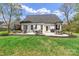 Beautifully landscaped backyard with patio and ample seating at 835 Ryans Pl, Fort Mill, SC 29715