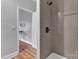 Updated shower features gray tiling and modern fixtures at 835 Ryans Pl, Fort Mill, SC 29715