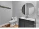 Modern bathroom with stylish vanity, round mirror, and updated toilet at 835 Ryans Pl, Fort Mill, SC 29715