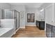 Bright bathroom features a soaking tub, glass shower, and modern vanity with dark cabinetry at 835 Ryans Pl, Fort Mill, SC 29715