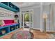 Bright foyer with colorful rug and seating, plus statement decor at 835 Ryans Pl, Fort Mill, SC 29715