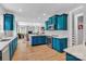 Bright kitchen with quartz countertops, and blue cabinets, open to living spaces at 835 Ryans Pl, Fort Mill, SC 29715