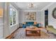 Cozy living room with hardwood floors, large window, and stylish decor at 835 Ryans Pl, Fort Mill, SC 29715