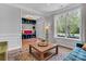 Inviting living room with large window, decor, and access to the entry foyer at 835 Ryans Pl, Fort Mill, SC 29715
