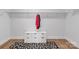 Bright walk-in closet with white shelving, storage cabinet, and stylish animal print rug at 835 Ryans Pl, Fort Mill, SC 29715