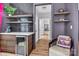 Stylish wet bar featuring a beverage fridge, open shelves, and access to a hallway at 835 Ryans Pl, Fort Mill, SC 29715