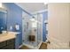 Bathroom featuring a glass shower with a built in bench at 8621 Sequoia Grove Ln, Charlotte, NC 28214