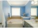 Bathroom featuring a soaking tub with fixtures and a vanity at 8621 Sequoia Grove Ln, Charlotte, NC 28214