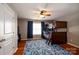 Bedroom with bunk beds, ceiling fan, blue rug and curtains, creating a cozy and functional space at 8621 Sequoia Grove Ln, Charlotte, NC 28214