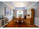 Elegant dining room with hardwood floors, classic lighting, and stylish furnishings at 8621 Sequoia Grove Ln, Charlotte, NC 28214